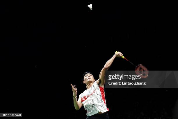 Kento Momota of Japan hits a shot against Shi Yuqi of China in the men's singles final on day 7 of Total BWF World Championships at Nanjing Youth...