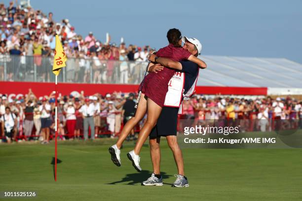Georgia Hall of England celebrates with her father / caddie Wayne Hall on the 18th green during the final round of the Ricoh Women's British Open at...