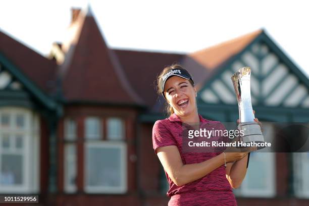 Georgia Hall of England poses for a photo with her trophy after winning the tournament during day four of Ricoh Women's British Open at Royal Lytham...