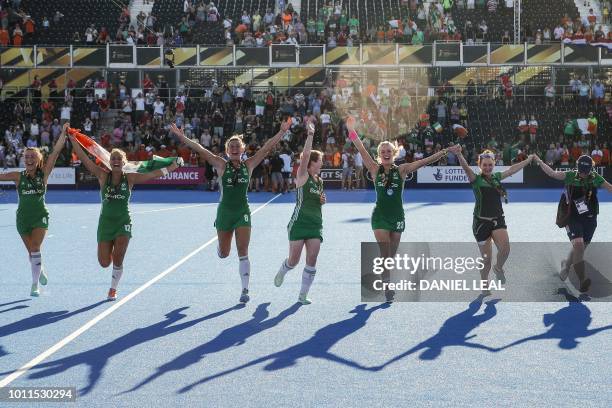 Ireland team celebrate with their silver medals after their field hockey final match between the Netherlands and Ireland at the 2018 Women's Hockey...