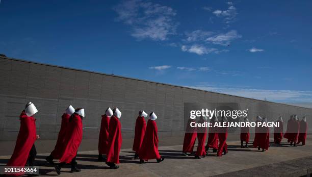 Activists in favour of the legalization of abortion disguised as characters from Canadian author Margaret Atwood's feminist dystopian novel "The...