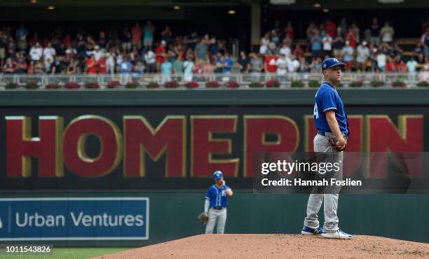 Danny Duffy of the Kansas City Royals looks on after giving up a grand slam to Jake Cave of the Minnesota Twins during the second inning of the game...