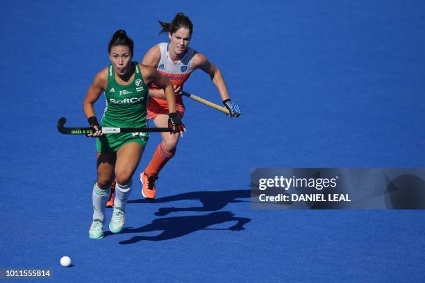 Ireland's Anna O'Flanagan and Netherland's Marloes Keetels vie for the ball during the gold medal final field hockey match between the Netherlands...