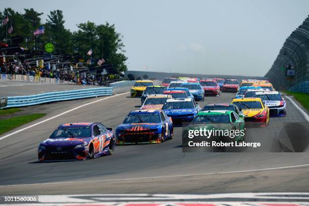 Denny Hamlin, driver of the FedEx Ground Toyota, leads Chase Elliott, driver of the SunEnergy1 Chevrolet, Kyle Busch, driver of the M&M's Crunchy...