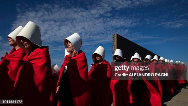 Activists in favour of the legalization of abortion disguised as characters from Canadian author Margaret Atwood's feminist dystopian novel "The...