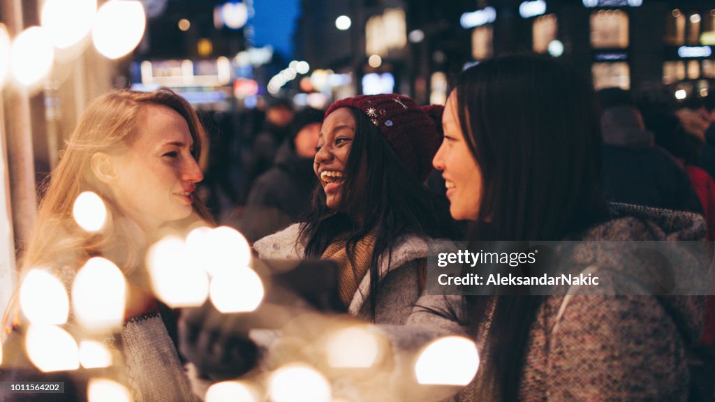 Friends taking selfies