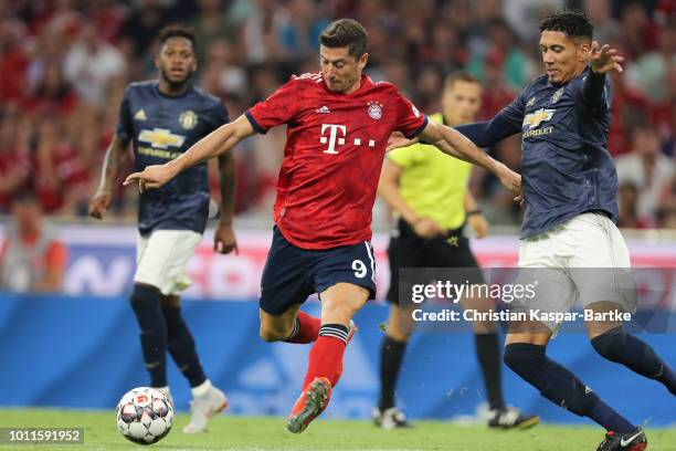 Robert Lewandowski of Bayern Muenchen challenges Fred of Manchester United during the pre-season friendly match between Bayern Munich and Manchester...