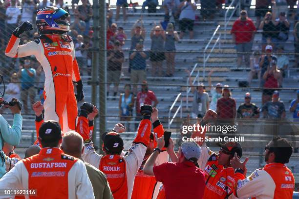 Chase Elliott, driver of the SunEnergy1 Chevrolet, celebrates winning the Monster Energy NASCAR Cup Series GoBowling at The Glen at Watkins Glen...