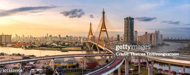 the bhumibol bridge (industrial ring road bridge) (bangkok, thailand) beautiful view at sunset, bangkok expressway top view, expressway and motorway at sunset aerial view from drone - bangkok stock pictures, royalty-free photos & images