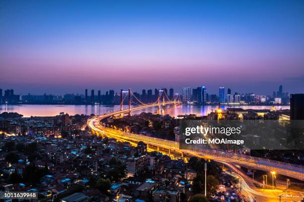 urban landscape in wuhan,china - wuhan city stock-fotos und bilder