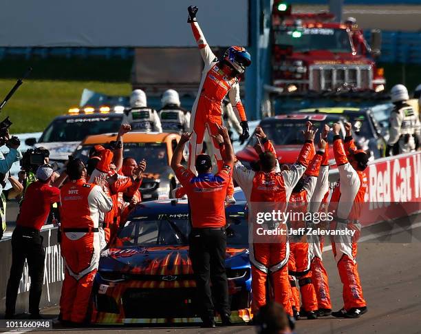 Chase Elliott, driver of the SunEnergy1 Chevrolet, celebrates after winning the Monster Energy NASCAR Cup Series GoBowling at The Glen at Watkins...