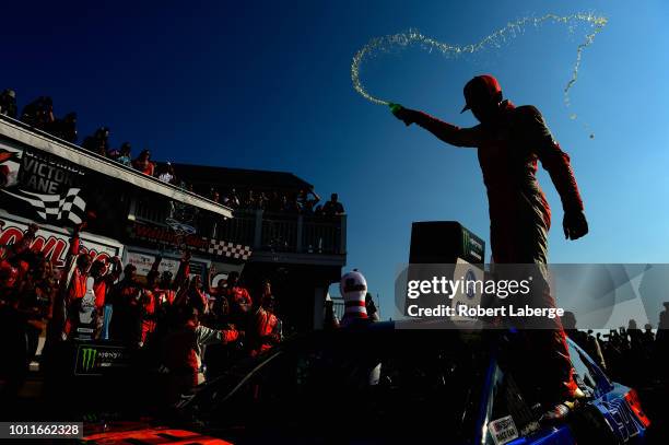 Chase Elliott, driver of the SunEnergy1 Chevrolet, celebrates in Victory Lane after winning the Monster Energy NASCAR Cup Series GoBowling at The...