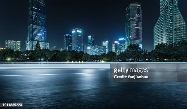 inner city elevated road by modern skyscrapers,shanghai - city night fotografías e imágenes de stock