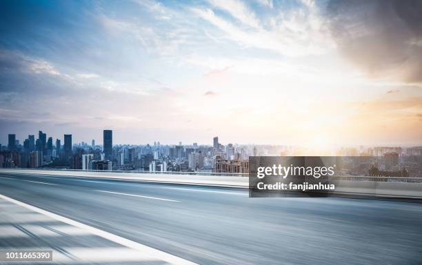 elevated road,shanghai skyline on background - empty highway stock pictures, royalty-free photos & images