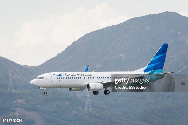 Boeing 737-8U3 passenger plane belonging to the Garuda Indonesia lands at Hong Kong International Airport on August 01 2018 in Hong Kong, Hong Kong....