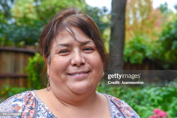 mature woman posing looking at the camera - chubby arab stock pictures, royalty-free photos & images