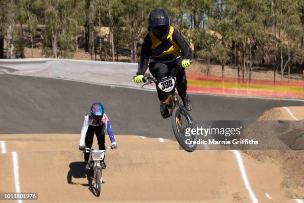 two girls racing on bmx bikes - スタントバイク ストックフォトと画像