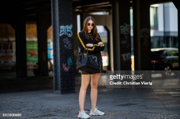 Maxilie Mlinarskij wearing sweater Cheap Monday, Zara shorts, Nike M2K Tekno sneakers, Hermes bag, APC Monaco & Adimas jewelery, Ray Ban sunglasses...