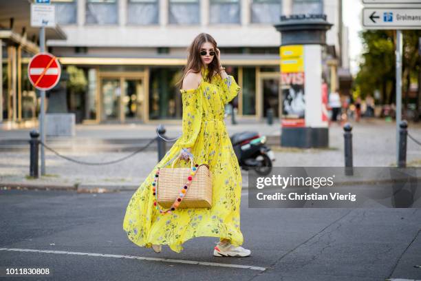 Maxilie Mlinarskij wearing yellow maxi dress Self Portrait, Nannacay bag, Nike M2K Tekno sneakers, Ray Ban sunglasses on August 5, 2018 in Berlin,...