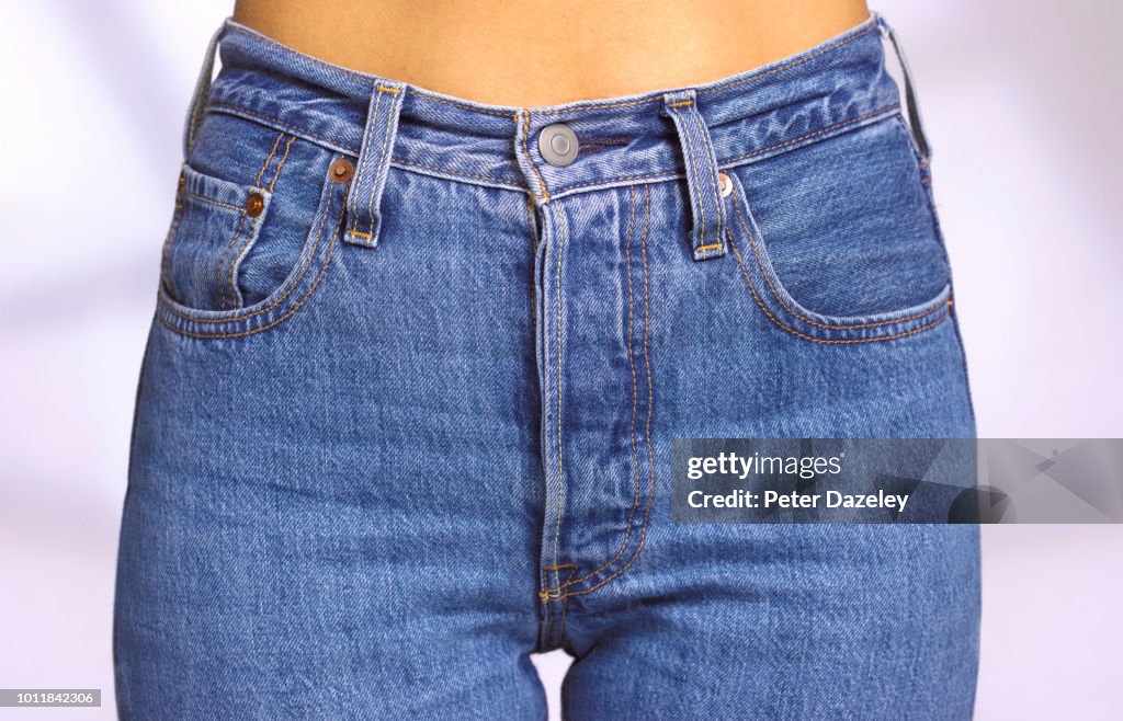 Close up of front of woman wearing denim jeans
