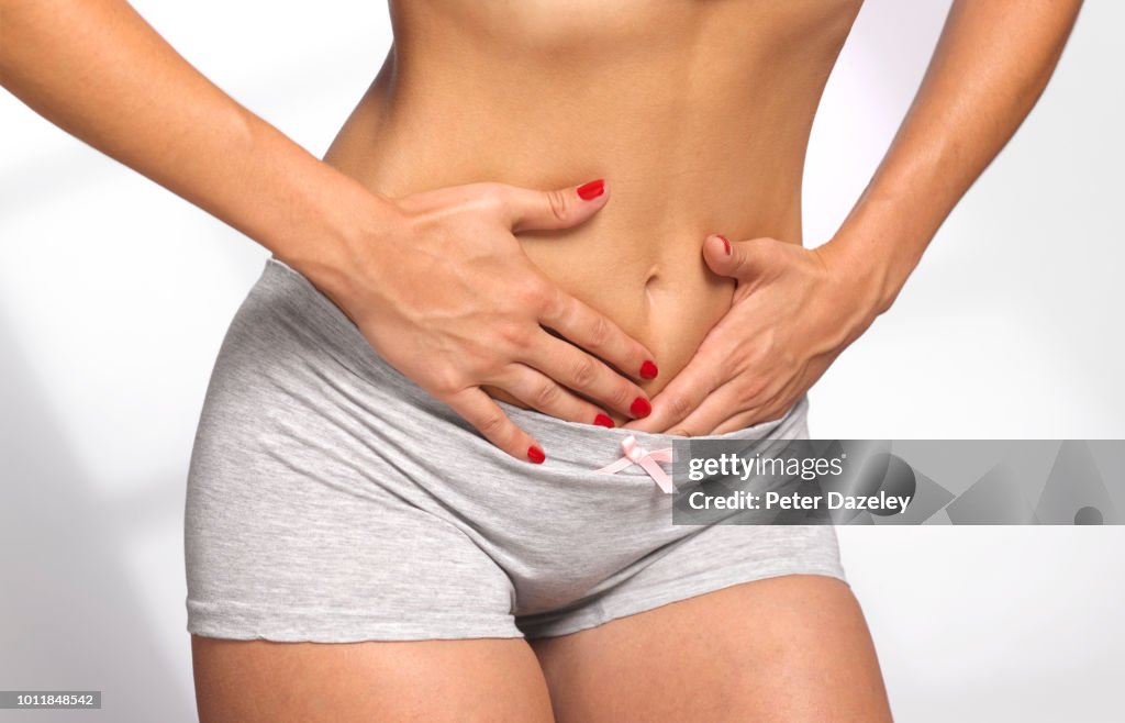 Women massaging her painful stomach