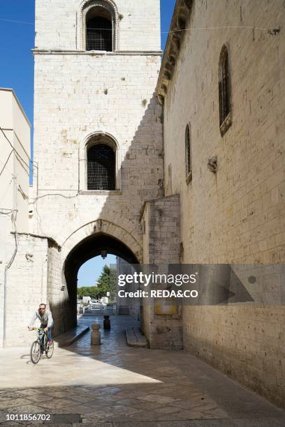 Cyclist in Via del Duomo street Historic Center Barletta Apulia Italy Europe.