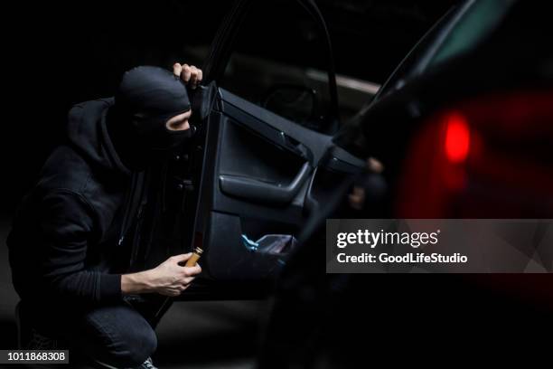 car thief - car theft stock pictures, royalty-free photos & images