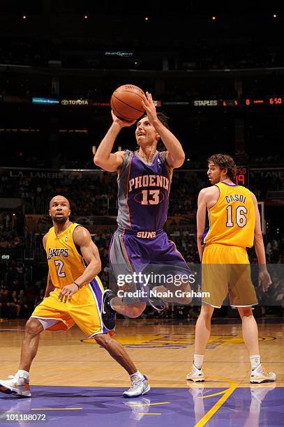 Steve Nash of the Phoenix Suns takes a shot while Derek Fisher, and Pau Gasol of the Los Angeles Lakers look on in Game Five of the Western...