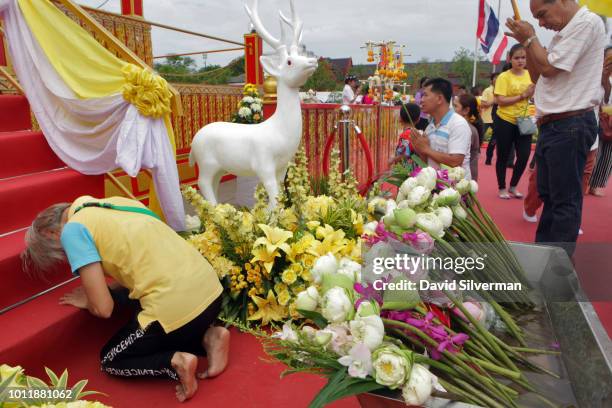 Thai Buddhists offer prayers at a shrine holding a relic of the Lord Buddha during Asahna Bucha celebrations on July 27, 2018 in Bangkok, Thailand....