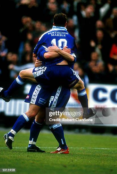 Michael Curcija ,Nick Orlic and Goran Lozanovski of South Melbourne celebrate their 1999 NSL finals win over Sydney United at Bob Jane...