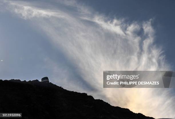 The 'Refuge du Gouter' shelter is seen atop the famous 'Couloir du Gouter' on the 'Voie Royale' route on August 6, 2018 in the Mont-Blanc range near...