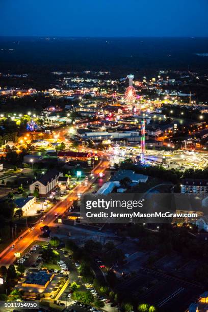 nighttime aerial view of hwy 76, branson missouri - 1011957648,1011945618,1011950492,1011960800,1011954950,1011953954,1015768380,1015768366,1015768370,1015768372,1015768382,1015768398,1015768412,1015768410,1015768414,1015768418,1015768438,1015768448,1015768450,1015768488,1015768474,1015768478,1015768504,1015768508,1016083590,1016083634,1016083592,1016083608,1016083686,1016083708,1016083780,1016083774,1016083796,1016083828,1016083994,1016083992,1016083982,1016083980 stock pictures, royalty-free photos & images