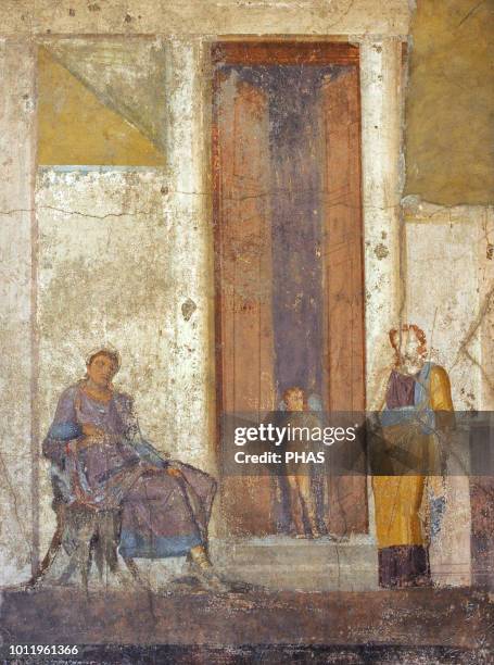 Roman fresco depicting Paris, seated, awaits the prize promised to him by Aphrodite. Eros, at the door, points to Helen, urging him to make the...