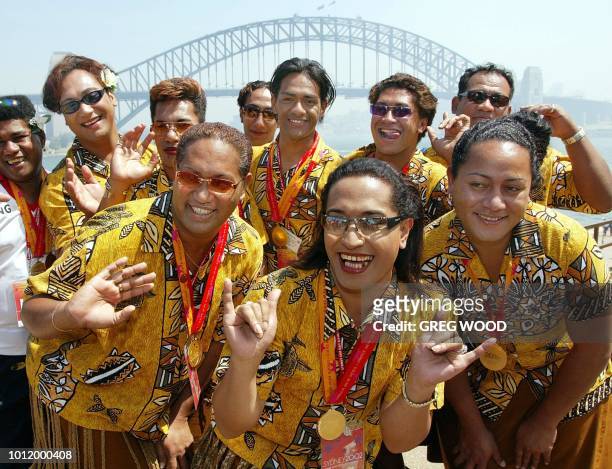 The Tongan gold medal winning netball team from the 2002 Gay Games, pose in front of the Sydney Harbour Bridge 08 November 2002, during a group photo...