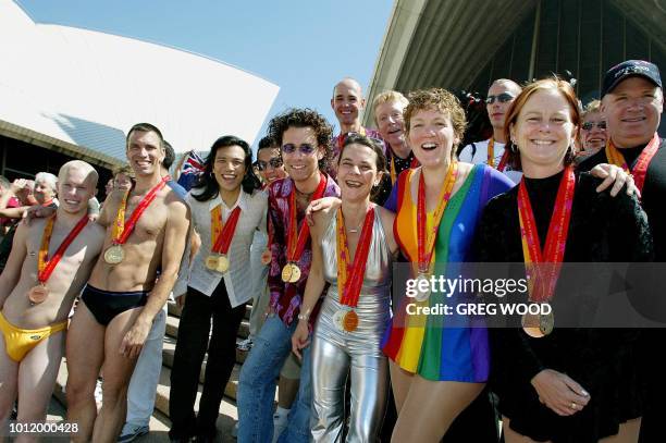 Medal winners from the 2002 Gay Games, gather on the steps of the Sydney Opera House 08 November 2002, for a group photo session. The games have seen...