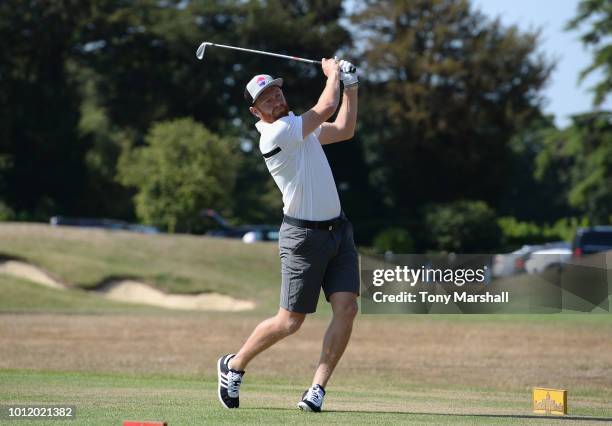 Jonny Bairstow plays his first shot on the 1st tee during the PCA Team England Golf Day at Stoke Park on August 6, 2018 in Stoke Poges, England.