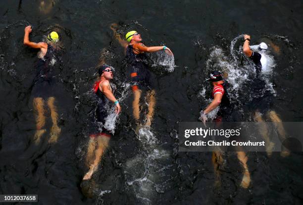 Participants compete in the swim leg of the race during IRONMAN Maastricht-Limburg on August 5, 2018 in Maastricht, Netherlands.