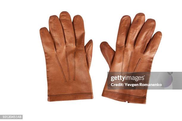 pair of brown leather gloves - leather gloves stock pictures, royalty-free photos & images