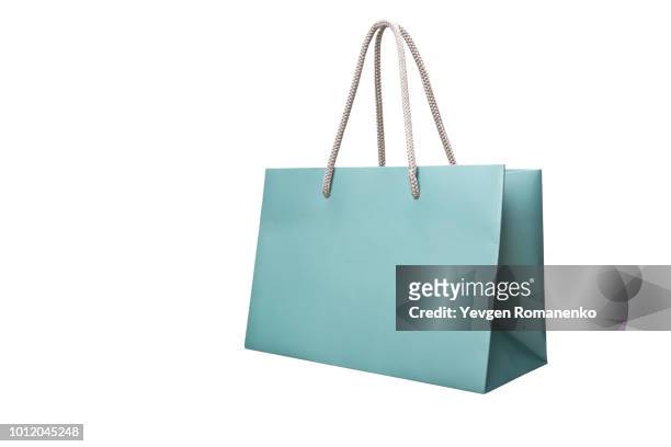 blue paper shopping bag isolated on white - grocery bag stock pictures, royalty-free photos & images