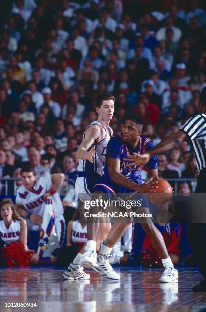 Billy McCaffrey of the Duke Blue Devils defends Sean Tunstall of the Kansas Jayhawks during the 1991 NCAA Photos via Getty Imagess via Getty Images...