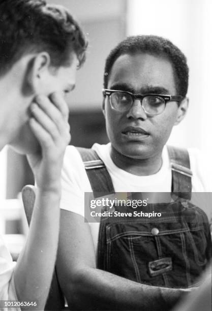 American Civil Rights activist Bob Moses speaks with a student volunteer, Oxford, Ohio, 1964.