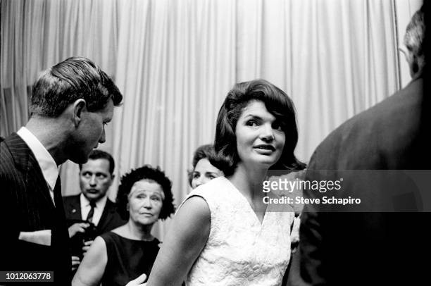 View of United States Attorney General Robert F Kennedy and his sister-in-law former US First Lady Jacqueline Kennedy as they attend a reception on...