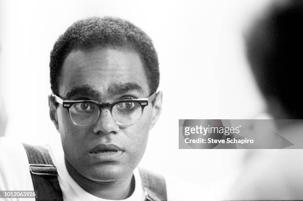 View of American Civil Rights activist Bob Moses as he speaks with a student volunteer, Oxford, Ohio, 1964.