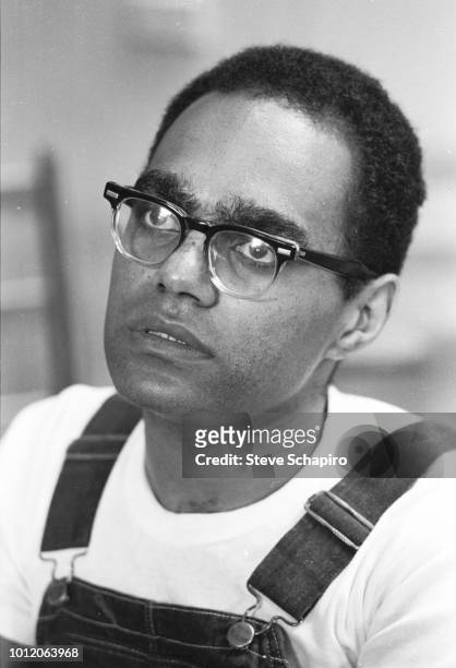 View of American Civil Rights activist Bob Moses as he speaks with a student volunteer, Oxford, Ohio, 1964.
