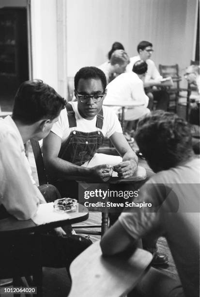 American Civil Rights activist Bob Moses speaks with a classroom of student volunteers, Oxford, Ohio, 1964.