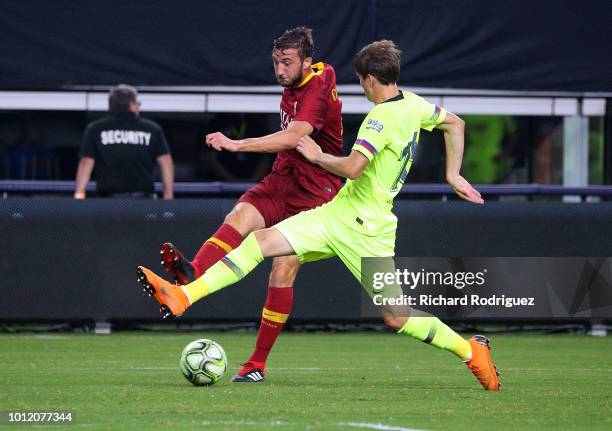 Alessandro Florenzi of AS Roma and Juan Miranda of FC Barcelona battle for the ball in the second half of the International Champions Cup match at...