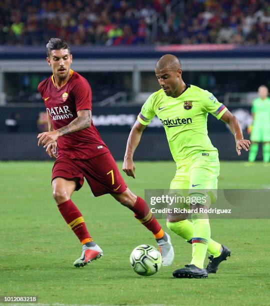 Lorenzo Pellegrini of AS Roma pursues Rafael Alcantara of FC Barcelona in the first half of the International Champions Cup match at AT&T Stadium on...