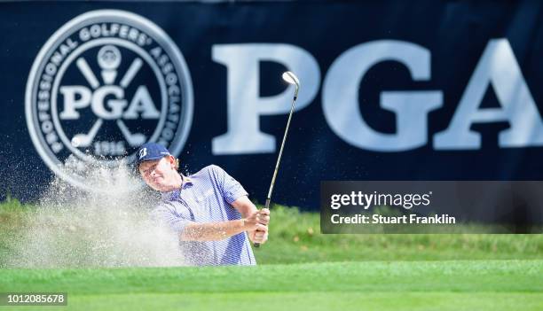 Brandt Snedeker of the United States plays a shot from a bunker during a practice round prior to the 2018 PGA Championship at Bellerive Country Club...