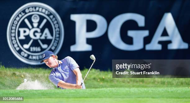 Brandt Snedeker of the United States plays a shot from a bunker during a practice round prior to the 2018 PGA Championship at Bellerive Country Club...