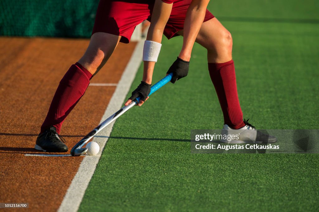 Low Section Of Player Playing Hockey On Field